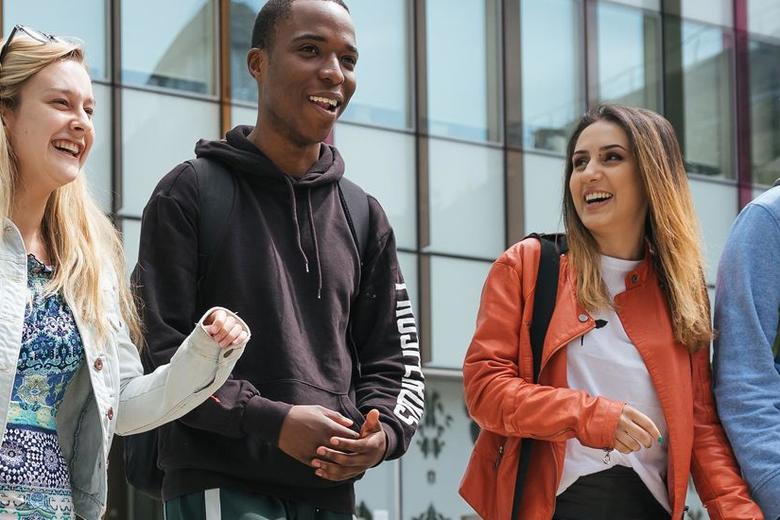 Students chat outside the Said Building